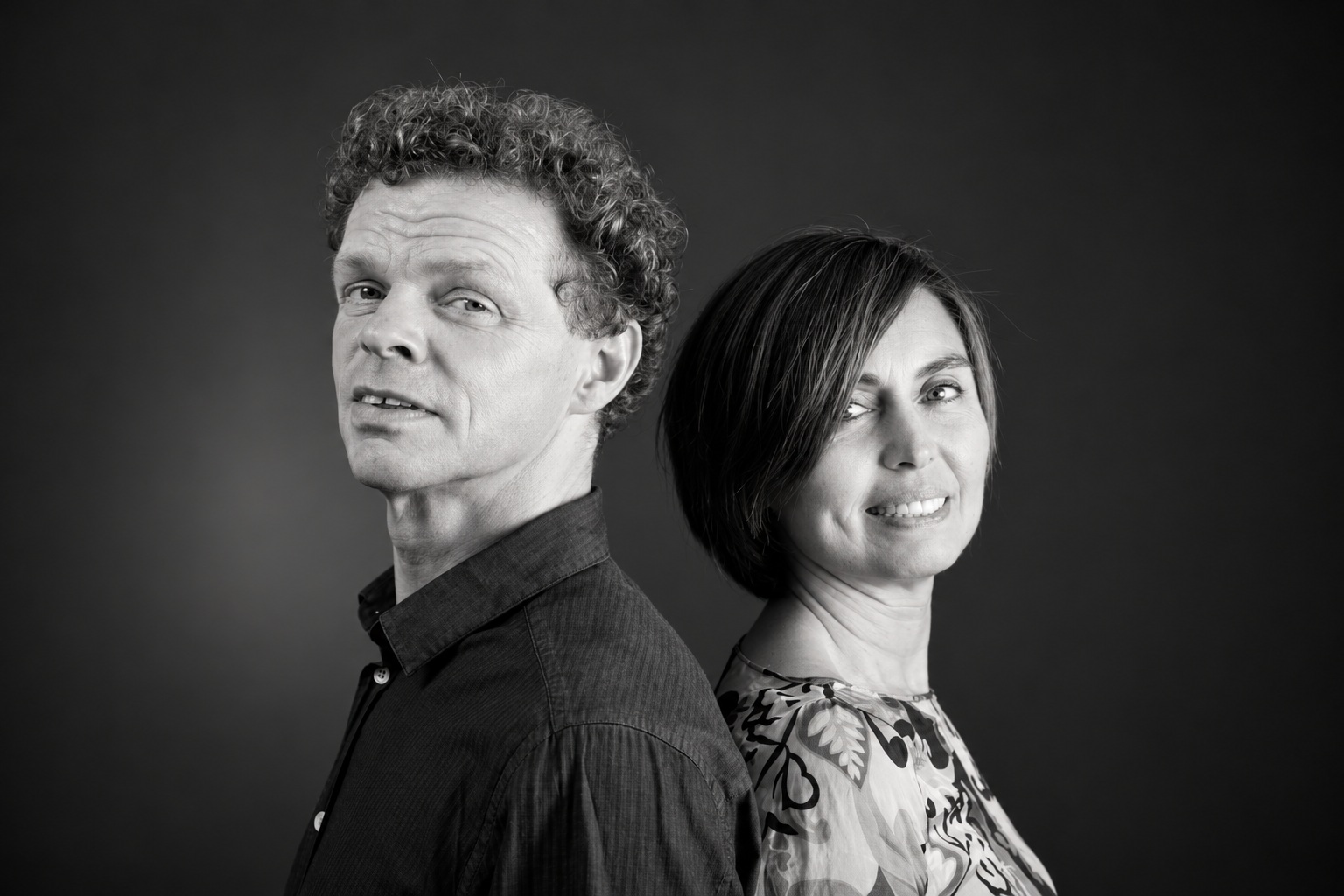 Dr Monica Takamiya Wik and Dr Peter Kristoffersen, plant molecular biologists and co-founders of SUKO Nordic, photographed together back to back in black and white