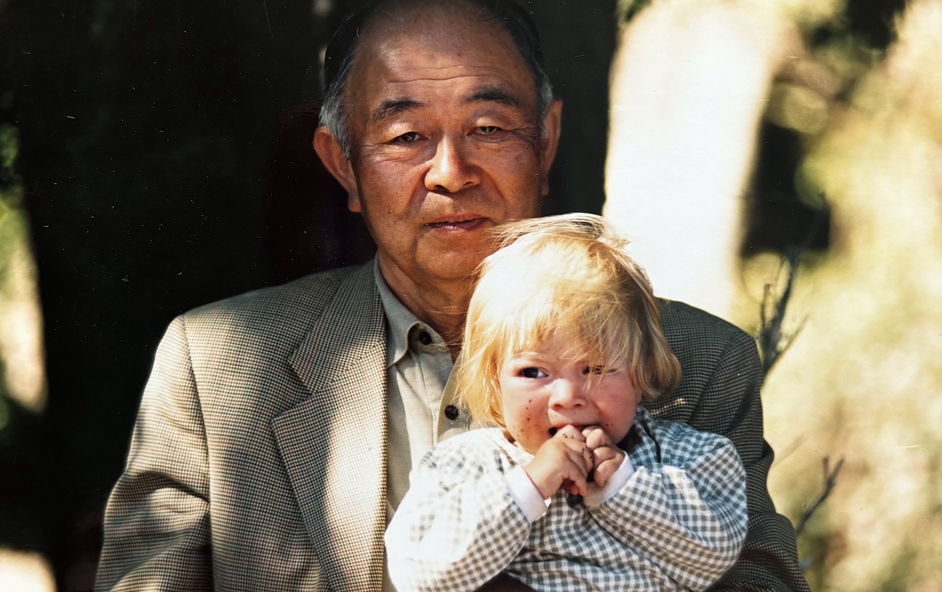 Our grandfather holding one of his young granddaughters.
