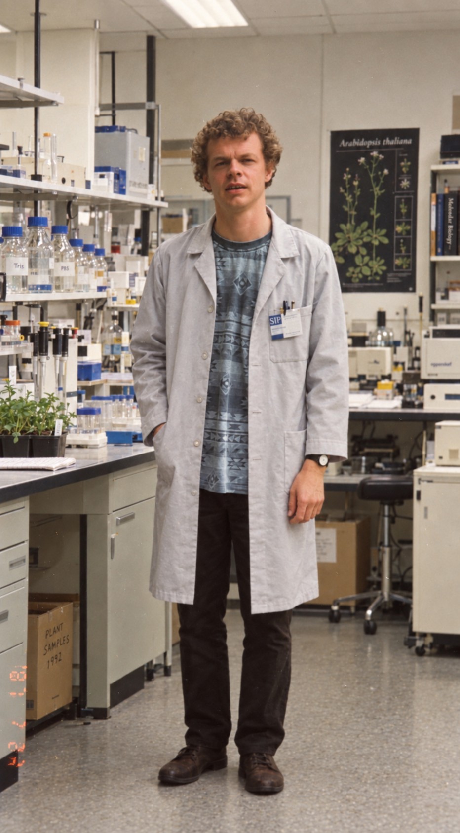 Dr Peter Kristoffersen wearing a laboratory coat in a plant molecular biology research laboratory.